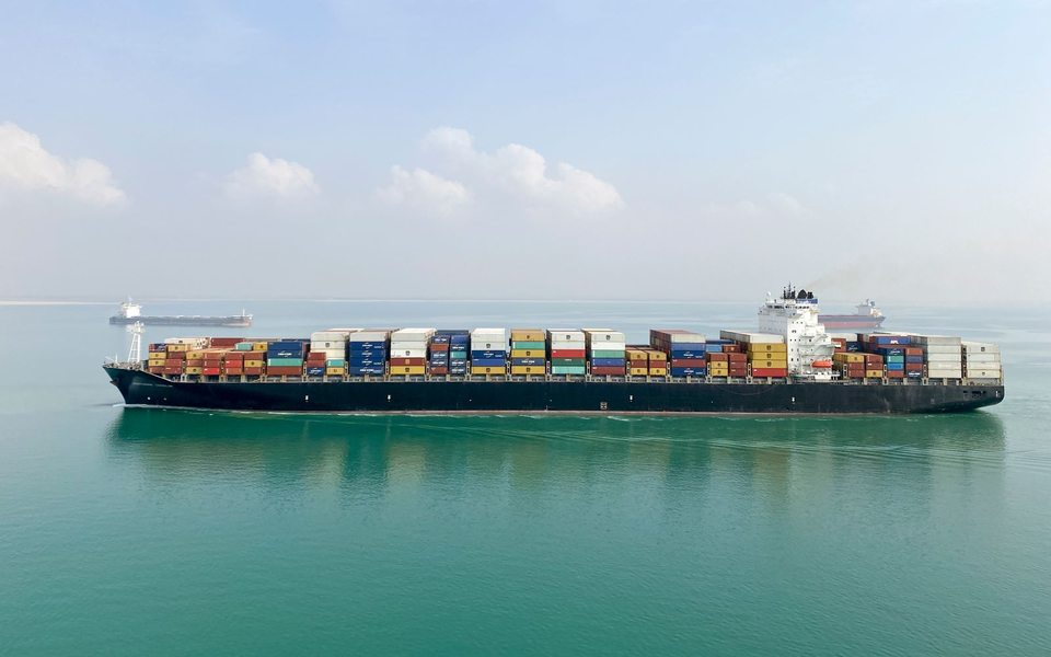 A container vessel on open water.
